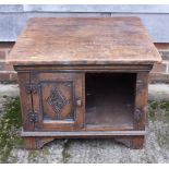 A carved oak low cupboard enclosed two doors, on bracket feet, 24" square