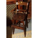A child's late 19th century beech and elm Windsor bar back high chair