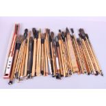 A quantity of Japanese calligraphy brushes, mostly with bamboo handles, various sizes
