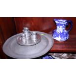 A pewter charger, 16 1/4" dia, six pewter plates, various pewter jugs and a blue and white Royal