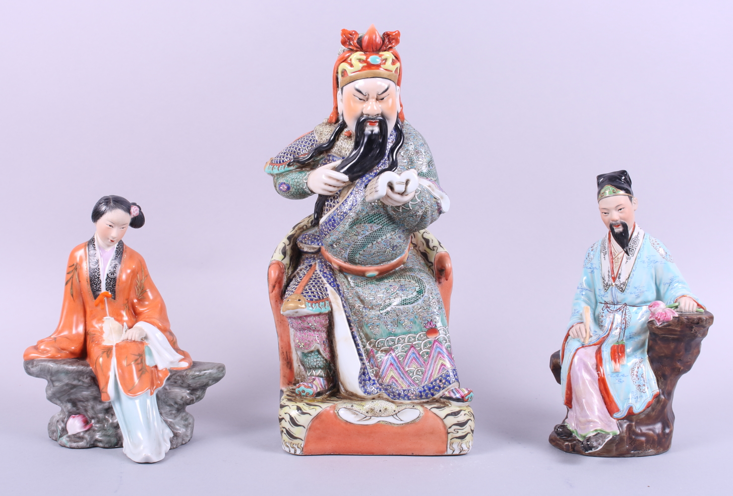 A Chinese figure of a seated scholar, 12" high, a figure of a seated lady, 7 1/2" high, and