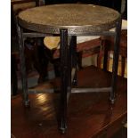 A Middle Eastern embossed brass circular table, on folding stand, 23 1/2" dia