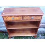 A mahogany bookcase, fitted two short drawers, on bracket supports, 30" wide, and a mahogany high