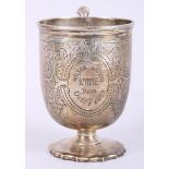 A silver pedestal christening mug with engraved decoration, 3oz troy approx