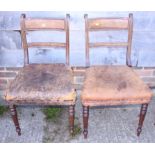 A pair of 19th century mahogany bar back side chairs, upholstered in a brown leather, on turned