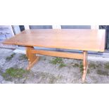 An oak plank top refectory table, on shaped panel end supports, top 29 1/2" x 72"