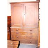 A 19th century grained as oak linen press, the upper section enclosed two doors over two short and