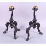 A pair of wrought iron fire dogs with brass ball finials, 13 1/2" high