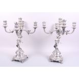 A pair of Portuguese silver five-light candelabra with cherub supports, 16 1/2" high, 183.7oz troy