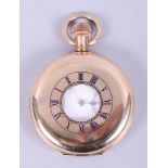 A Waltham Marquis half hunter pocket watch with 14ct gold plated case, white enamel dial with