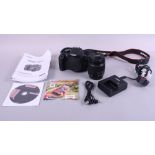 A Canon EOS 1200D digital single-lens reflex camera with EF-S 18-55mm zoom lens, in carry case