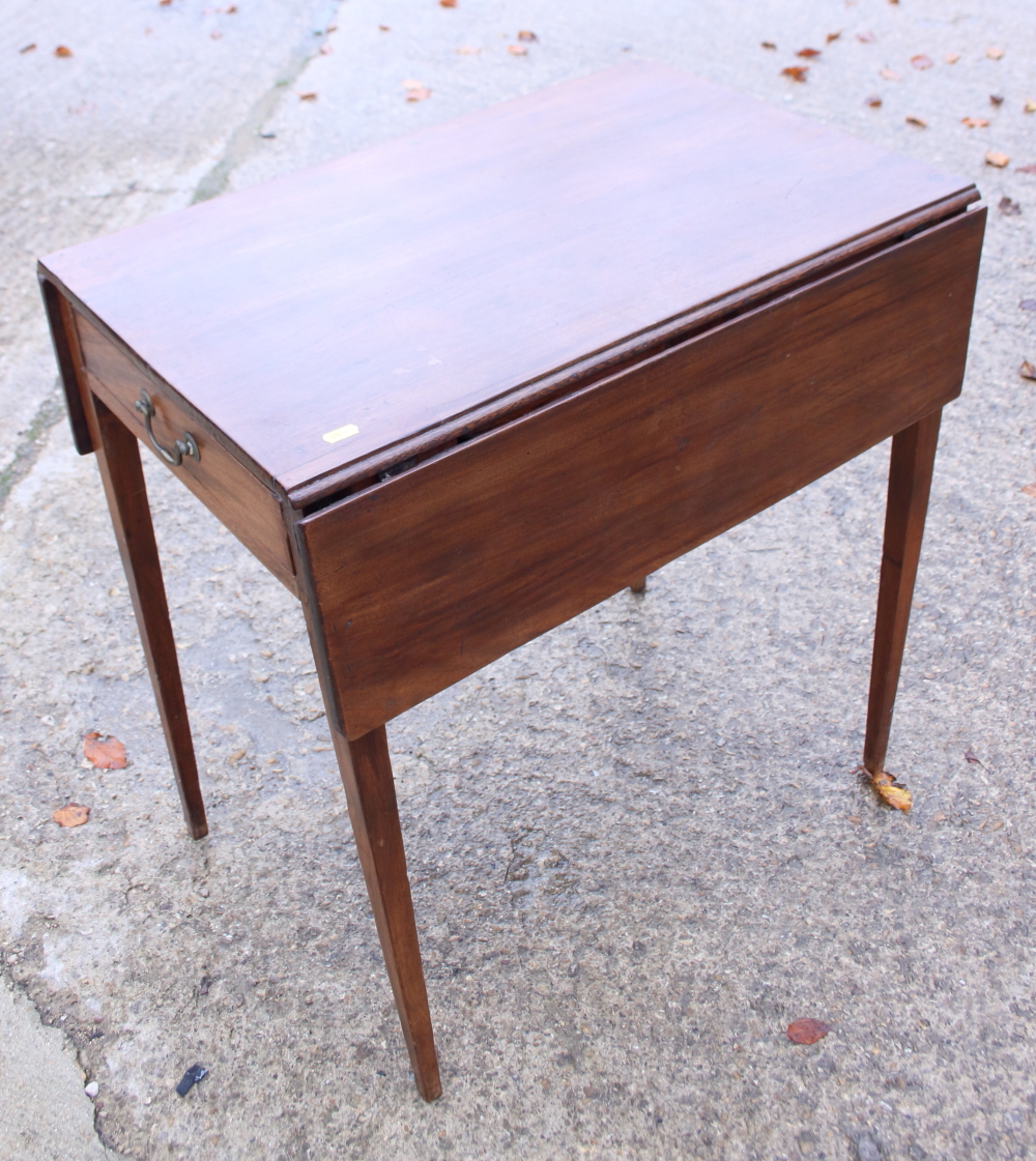 A mahogany Pembroke table, fitted one drawer, on square tapered supports, 27 1/2" wide, and a