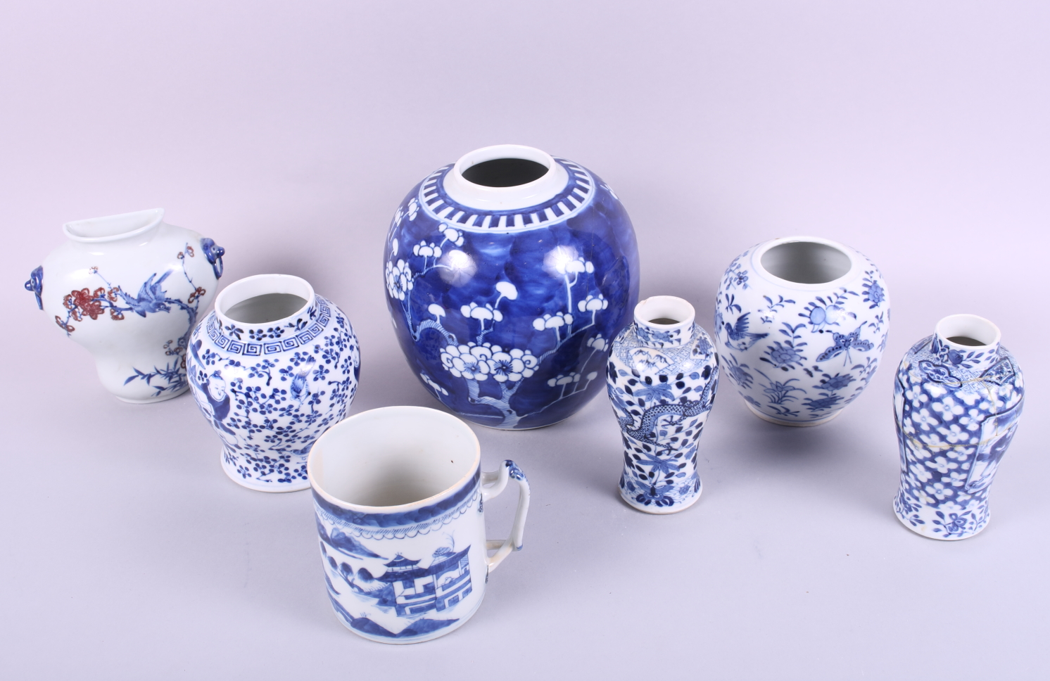 A 19th century Chinese mug, decorated boats, trees and houses, 4" high, two blue and white oviform