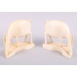 A pair of early 20th century African carved ivory antelope, 3 1/2" high