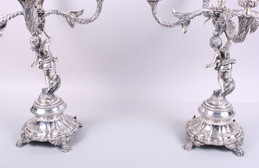 A pair of Portuguese silver five-light candelabra with cherub supports, 16 1/2" high, 183.7oz troy - Image 8 of 12