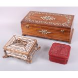 A wooden bone inlaid jewellery casket, a smaller similar mirrored casket and a cinnabar box