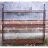 A 19th century mahogany three-tier open wall shelf, 26" wide