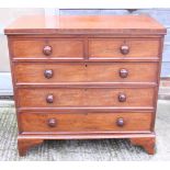 A 19th century mahogany chest of two short and three long graduated drawers with turned knob