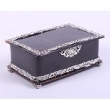 A rectangular tortoiseshell trinket box with embossed silver mounts and bun feet, by John Batson &