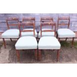 Six mahogany bar back dining chairs with rope twist carving, upholstered in a blue fabric, on turned