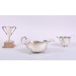 A silver sauce boat, a silver cream jug and a silver two-handled trophy cup, 7.8oz troy approx