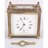 A brass and glass cased carriage clock with white dial and Roman numerals, by Mawson Swan and