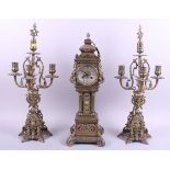 A brass clock garniture by Connard of Southport, clock 22" high