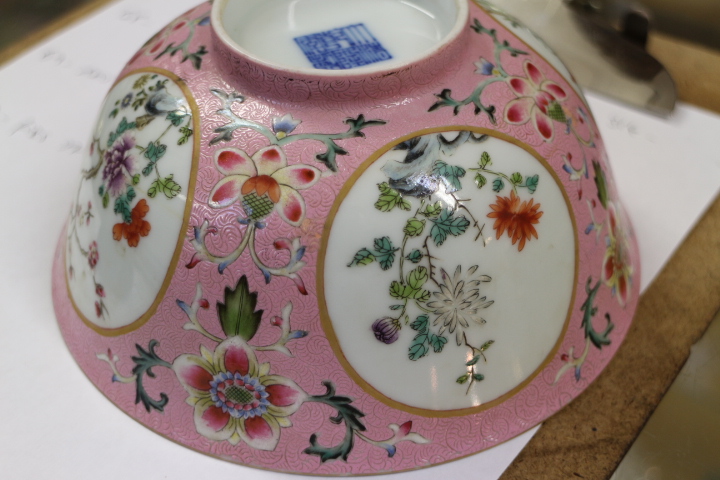 A Chinese porcelain bowl, decorated panels with trees and flowers on a pink ground, inside decorated - Image 6 of 7