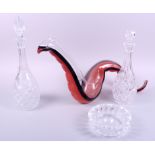 A Riedel tri-colour glass abstract decanter, two other glass decanters and an ashtray