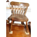 A child's late 19th century beech and elm chair with panel seat
