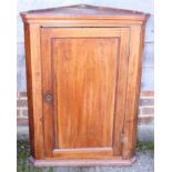 A late 19th century walnut corner hanging cupboard enclosed panel door, 27" wide