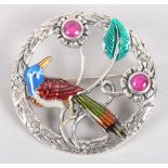 A white metal and enamel brooch, decorated parrot and gemset flowers, stamped sterling, 7 1/2" wide