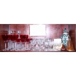A Royal Doulton vase and cover, various cranberry glasses, sherry and port glasses, two decanters,