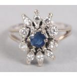A sapphire and diamond ring, in the form of a flower, in white metal mount, ring size M