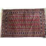 A Bokhara rug of traditional design with forty-two guls, 78" x 50" approx
