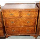 A bachelor's Georgian burr walnut chest of two short and two long drawers with brushing slide, on