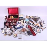 A collection of costume jewellery, cap badges, watches, compacts, a cut throat razor and other