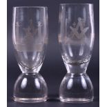 A pair of early 19th century Masonic firing glasses, on circular bases, 5 3/4" high