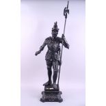 A spelter figure of a Norse warrior with halberd and sword, 41" high