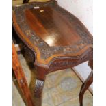 A late 19th century carved walnut shape top table, on cabriole supports, 27" wide