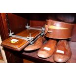 Two pairs of wooden shoe lasts, a wooden tie press and a leather collar box