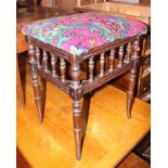 A carved mahogany foot stool, upholstered in an embroidered fabric, and an Edwardian dressing
