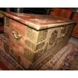 A Zanzibar type chest with hinged lid over three drawers with brass fittings and studwork, 50" wide