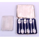 A cased set of six silver teaspoons and a silver cigarette case, 7.8oz troy approx