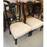 A pair of Edwardian carved low seat salon chairs and a 19th century oak spindle back Windsor chair