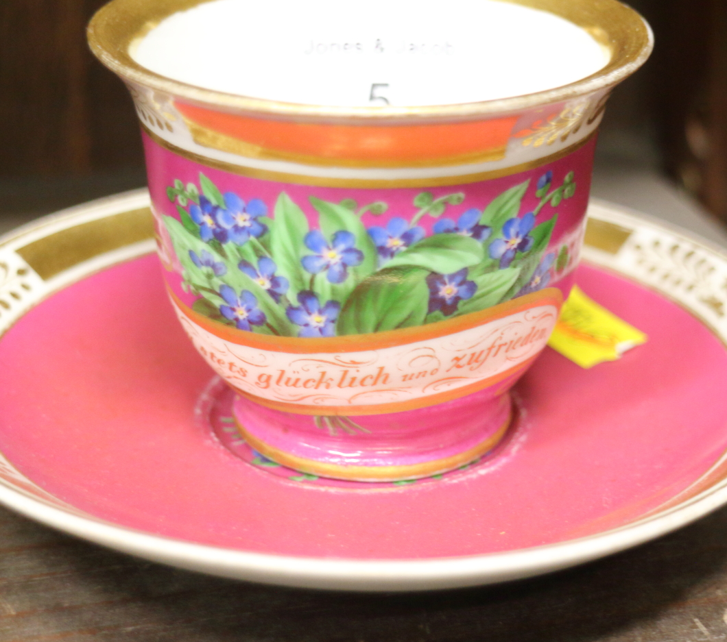 A German porcelain cabinet cup and saucer with a dark pink ground and gilt borders and another - Image 9 of 15