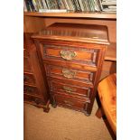 A French carved walnut bedside chest of four drawers, on turned supports, 15 1/2" wide