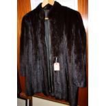 A faux fur jacket, size 14, and a mink three-quarter length jacket