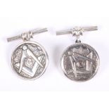 A pair of white metal cufflinks, decorated Masonic imagery, stamped sterling