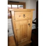 A pair of stripped pine bedside cabinets, fitted single drawer over cupboards, 16" wide